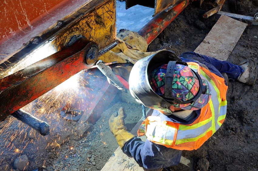 Welder working on the Women's College Hospital demolition project
